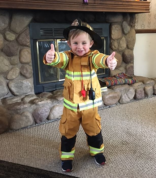 A little fireman with his thumbs in the air, everything is okay